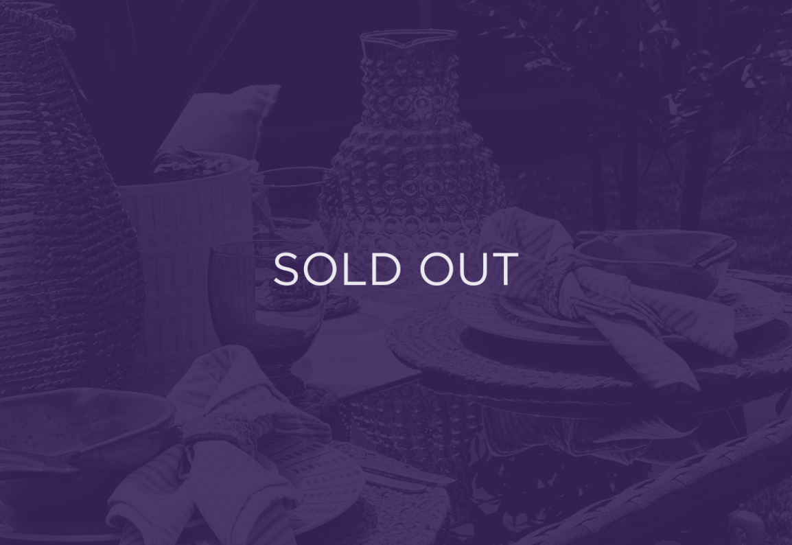 An image of a decorated table, with a purple overlay and text that says sold out