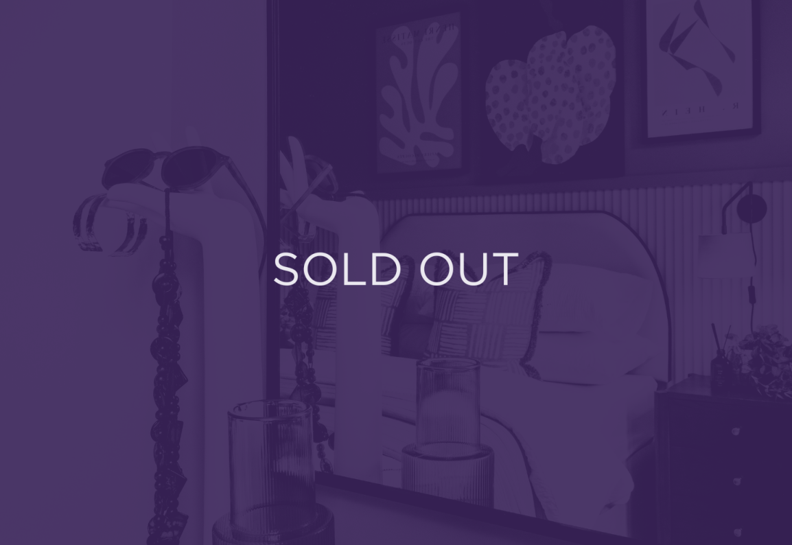 an image of a bedroom, with a purple overlay and text that says sold out