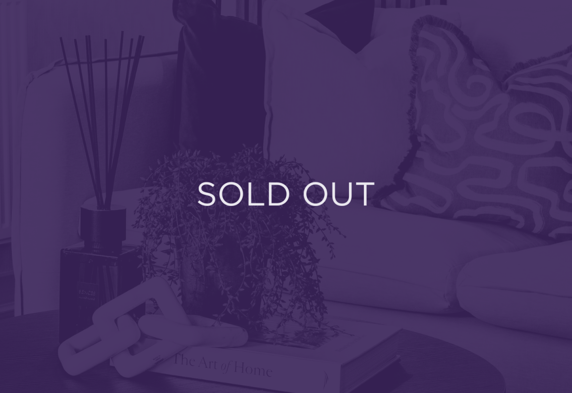 an image of a living room table, with a purple overlay and text that says sold out