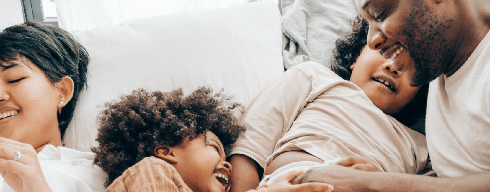 Happy family laughing with each other