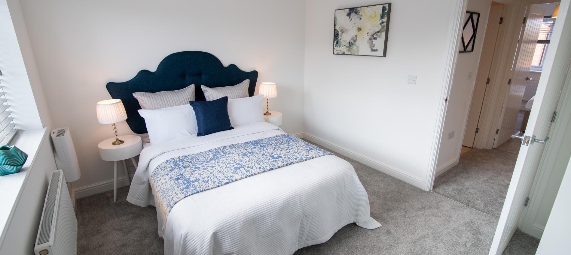 Navy bedroom in the show home at The Maltings, Beeston
