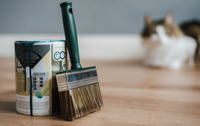 Paint bucket and brush in home