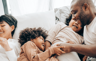 Happy family laughing with each other