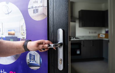 Unidentifiable person opening front door