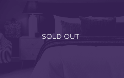 an image of a bedroom, with a purple overlay and text that says sold out
