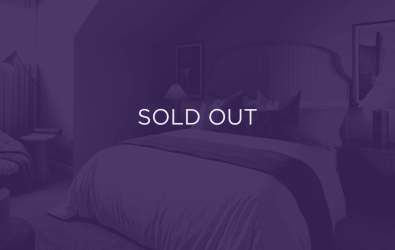 an image of a bed with a purple overlay and text that says sold out