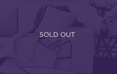 an image of a sofa, with a purple overlay and text that says sold out