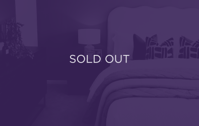 an image of a bed and bedside table, with a purple overlay and text that says sold out