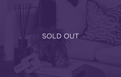 an image of a living room table, with a purple overlay and text that says sold out