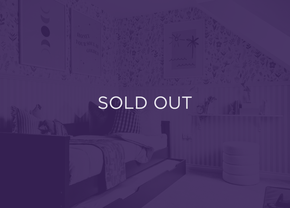 an image of a sofa with a purple overlay and text that says sold out