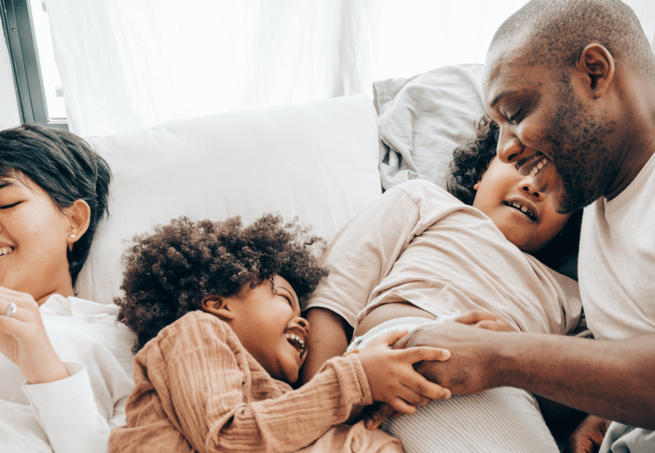 Happy family laughing with each other